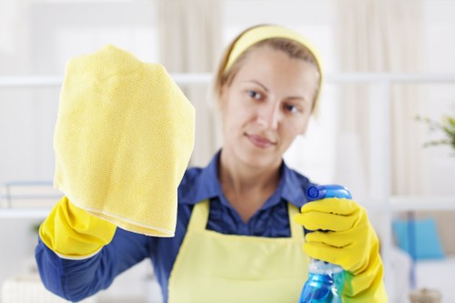Technician treating pet stain on carpet with enzyme solution